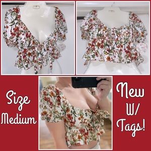 New w tags ! Cute ruffle bottom,tie front, puff sleeve crop top sz. M